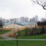 large horse barn with metal roof