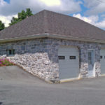 custom pole garage with stone veneer