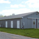 large gray horse barn