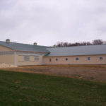 large horse barn with metal roof