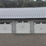 new pole barn construction with three doors