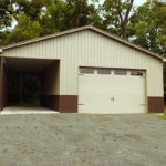 pole garage with big door and storage bay