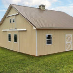 small tan horse barn