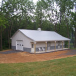 small white horse barn