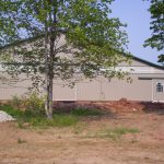 horse barn storage facility with gray siding